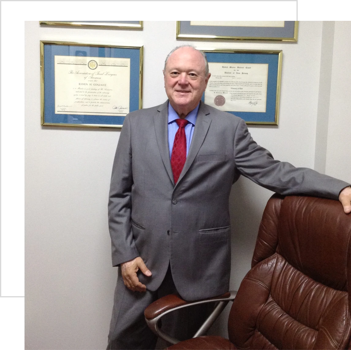 Professional in office setting with awards